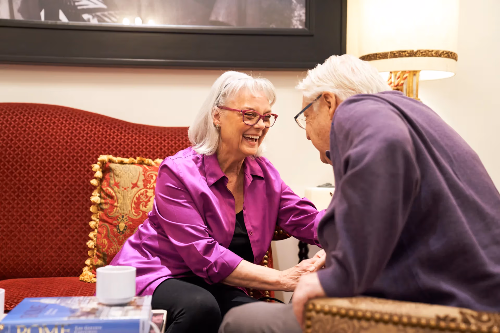 Two residents sharing a warm moment together in the community