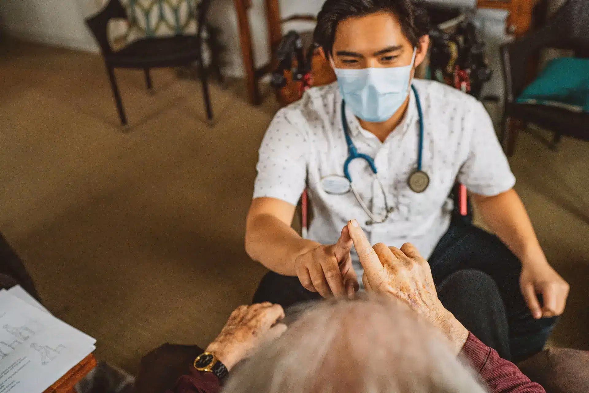 Physician reviewing a care plan with an Áegis Living resident