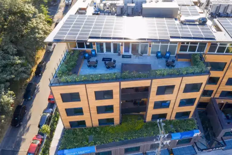 Aerial view of the rooftop solar array and rooftop garden at Áegis Living Lake Union