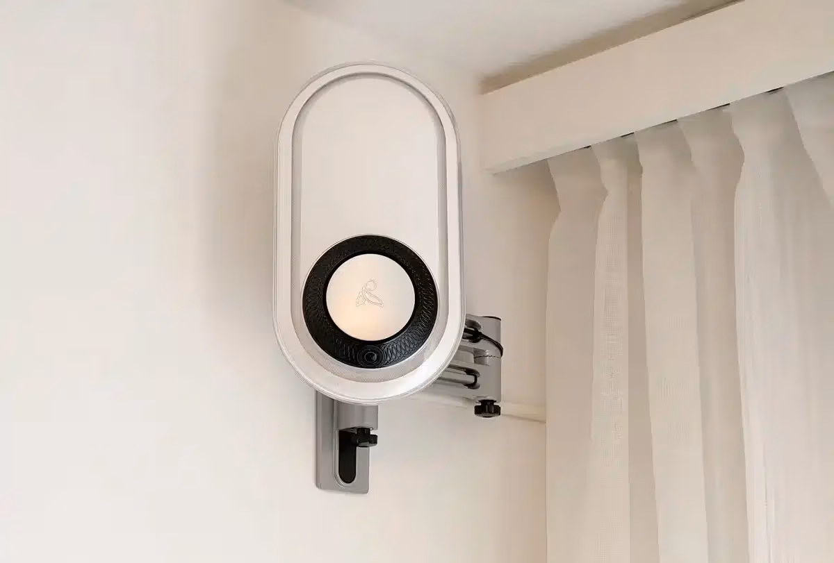 The wall-mounted AUGi sensor installed in a resident apartment