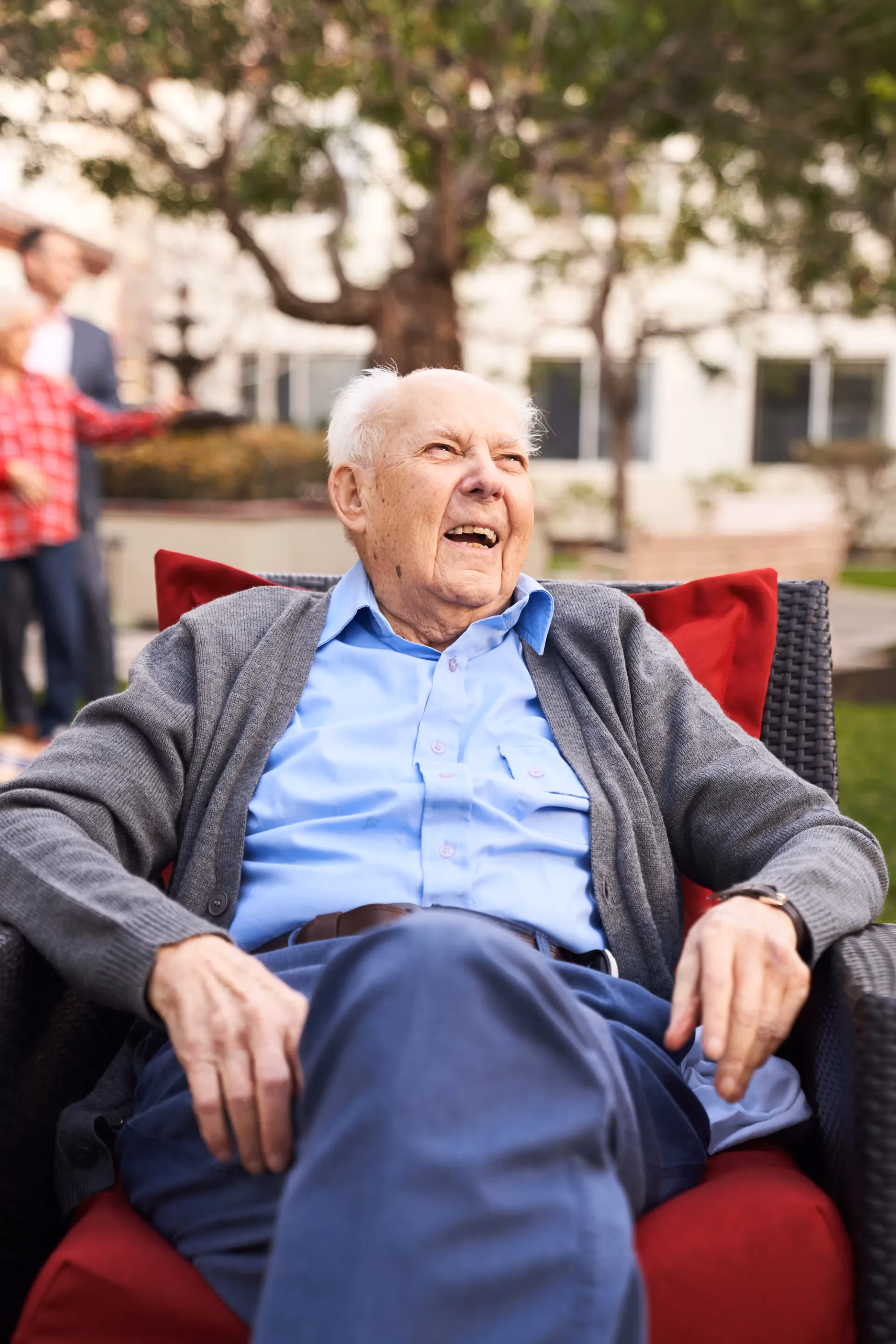 A resident resting peacefully in the fresh air on a community patio