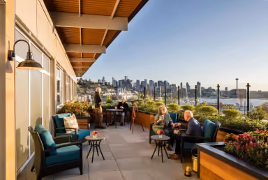 Rooftop terrace at Áegis Living Lake Union overlooking the water and the Seattle skyline