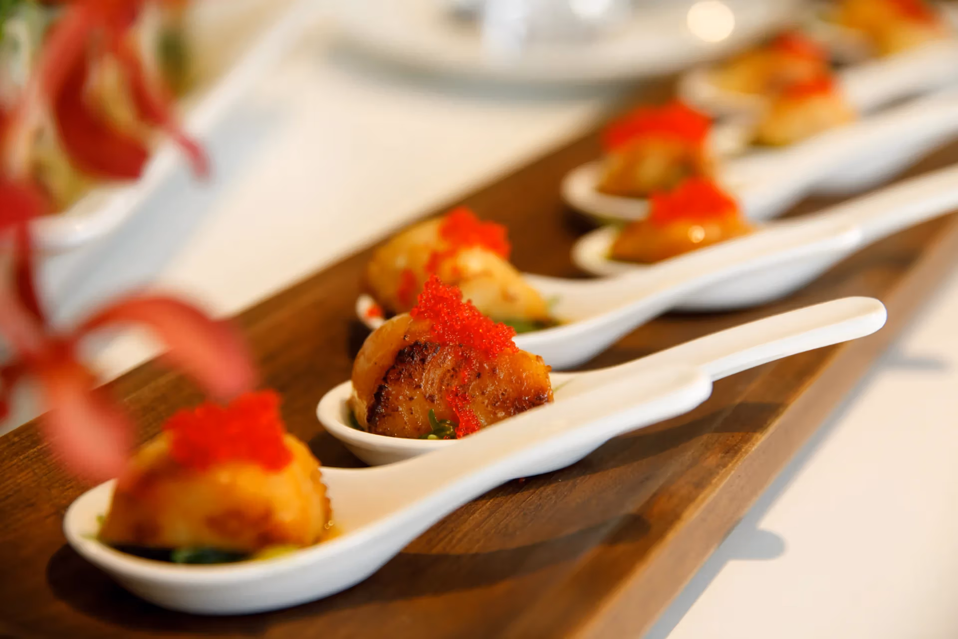 Chef-prepared appetizers elegantly plated on tasting spoons