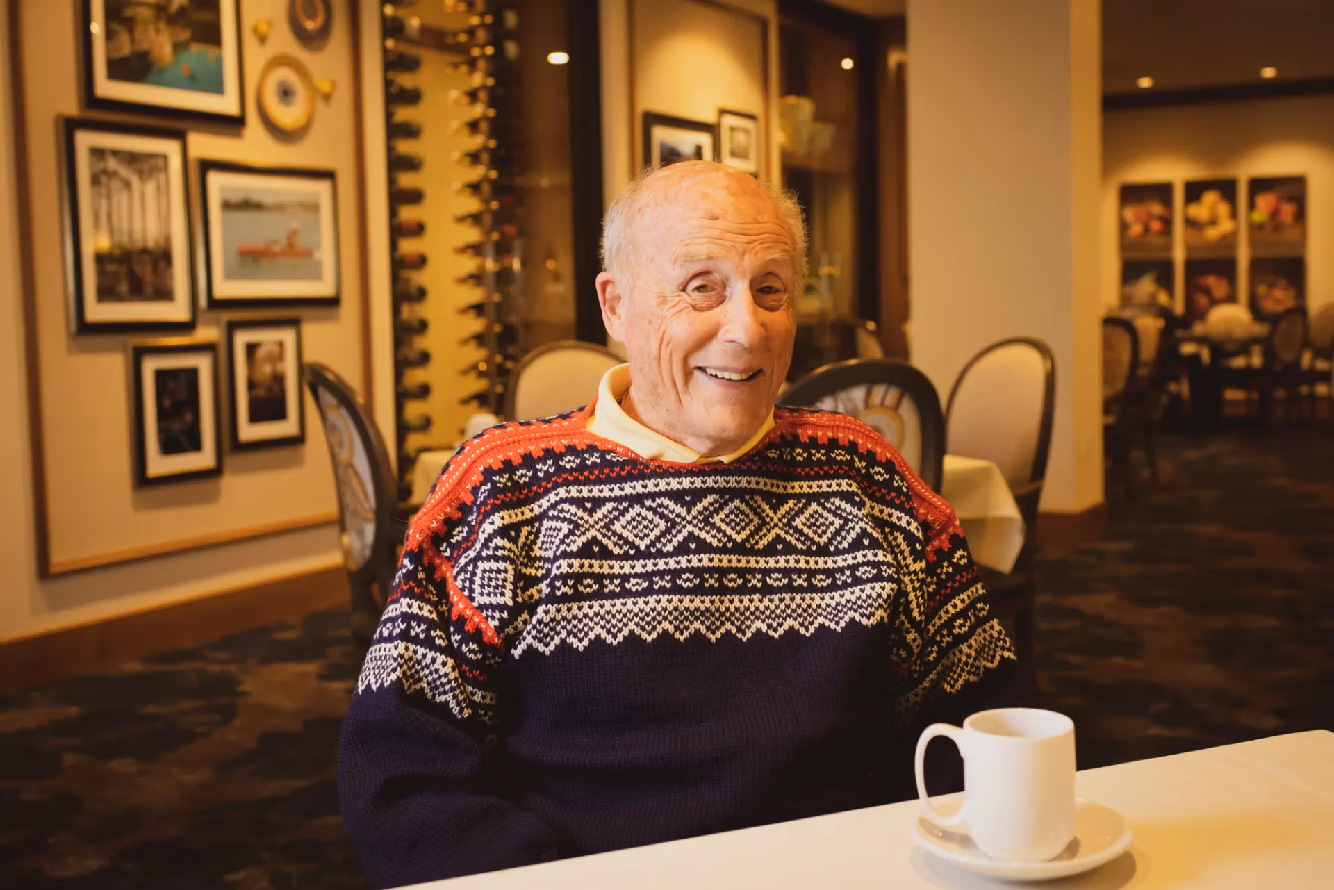 A resident enjoying a warm cup of coffee during a quiet morning