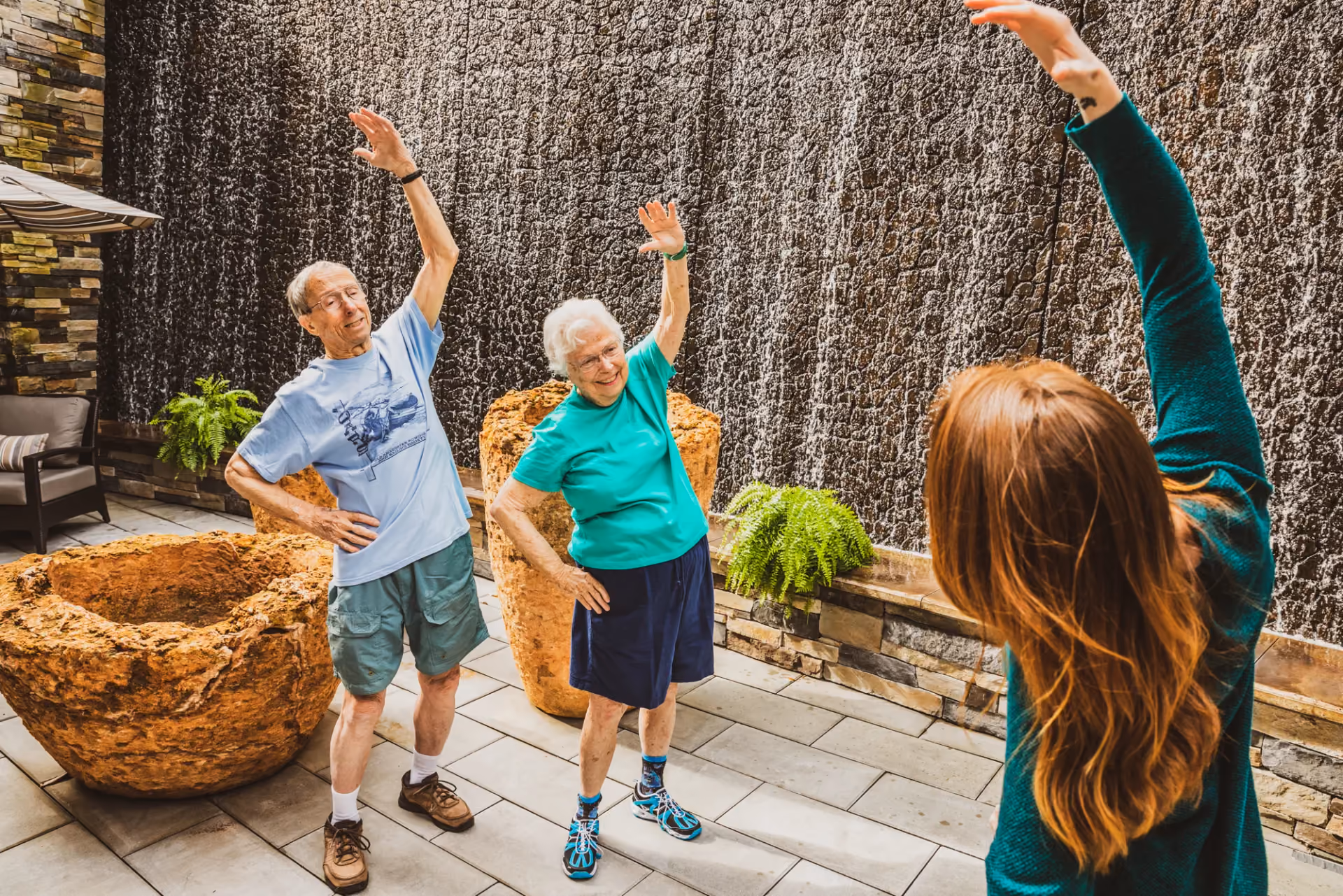Residents exercising together in the community courtyard