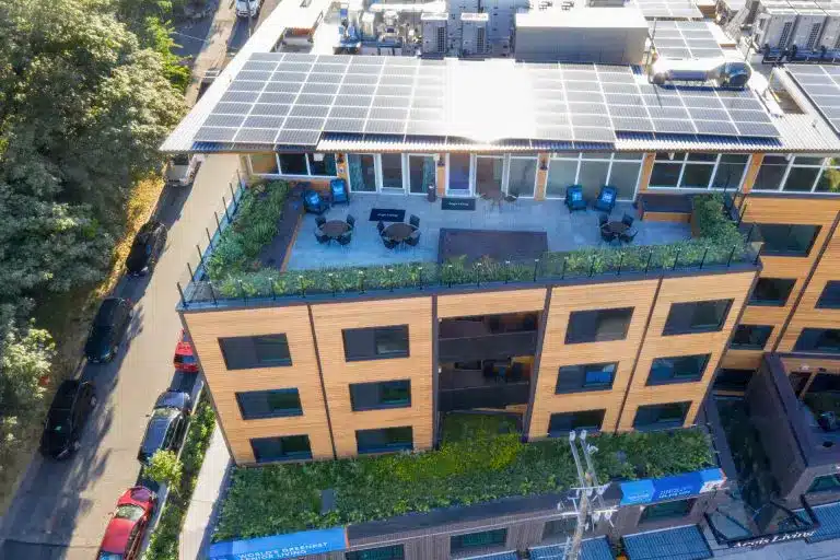 Aerial view of the rooftop solar array and rooftop garden at Áegis Living Lake Union
