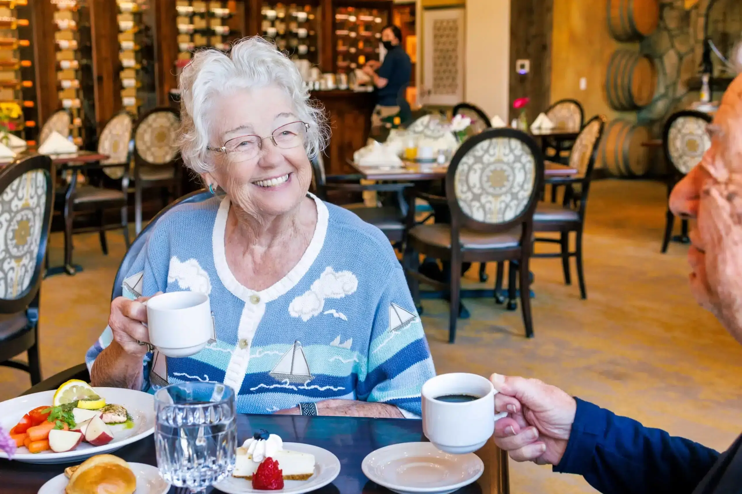 Resident enjoying coffee in the dining room
