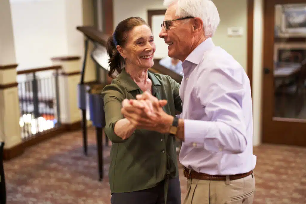 Residents dancing at a community event