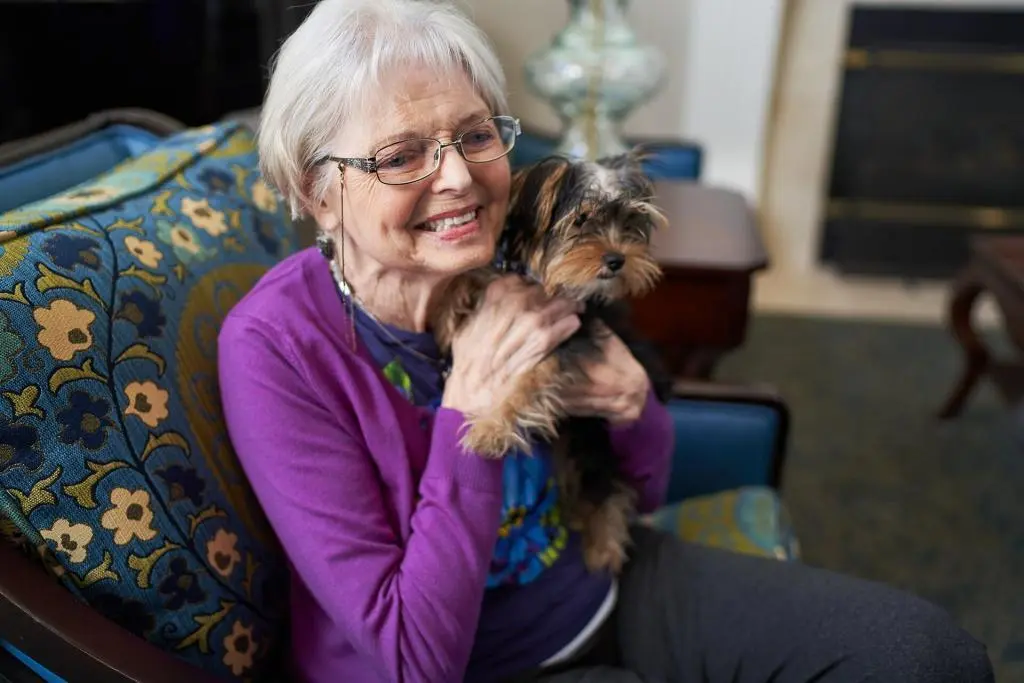 Resident with therapy dog
